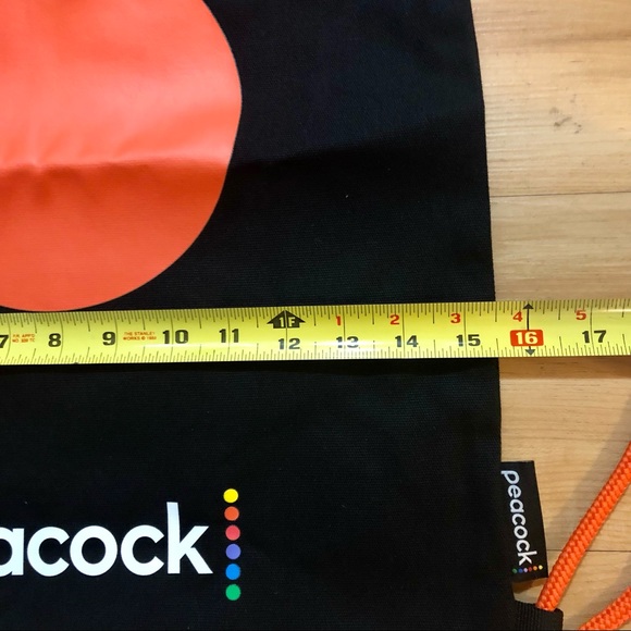 Peacock Branded Black and Orange Canvas Drawstring Tote Backpack - Picture 4 of 5
